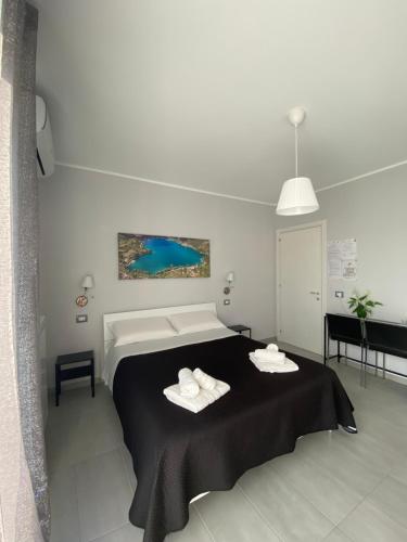 a bedroom with a bed with two towels on it at Colline del sole in San Salvo