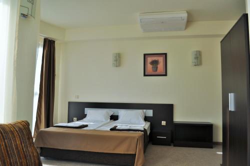 a bedroom with a bed in a room at Vikeya Guest House in Sapareva Banya