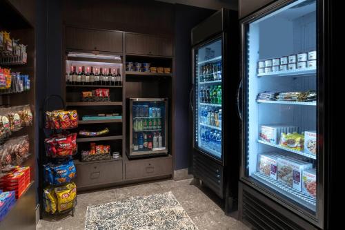 a refrigerator filled with lots of food and drinks at Residence Inn by Marriott Manchester Downtown in Manchester