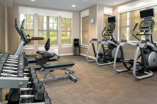 a fitness room with treadmills and elliptical machines at Residence Inn Port St Lucie in Port Saint Lucie