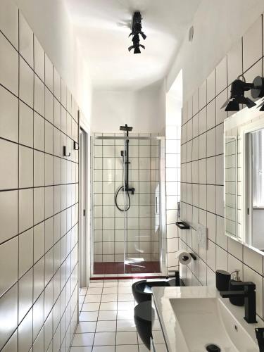 a bathroom with a shower and a sink at Casa Adorna in Cupra Marittima