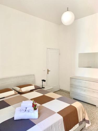 a bedroom with two beds with towels on them at Casa Adorna in Cupra Marittima