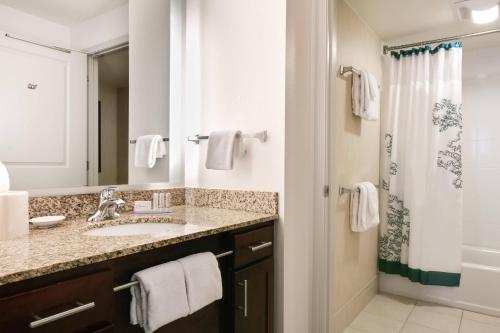 a bathroom with a sink and a shower at Residence Inn by Marriott Lincoln South in Lincoln