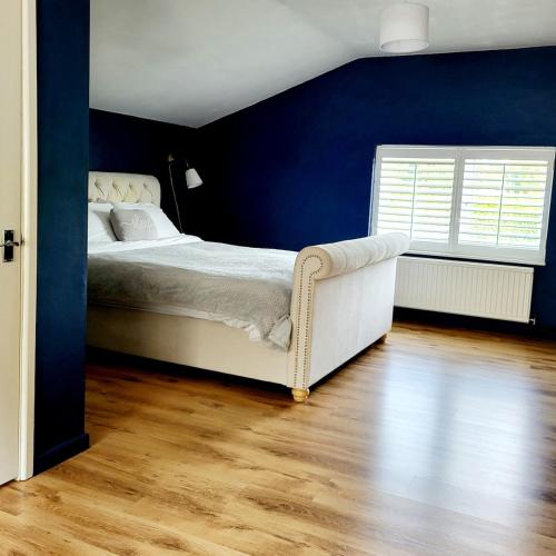 Voodi või voodid majutusasutuse Gavenny Cottage toas