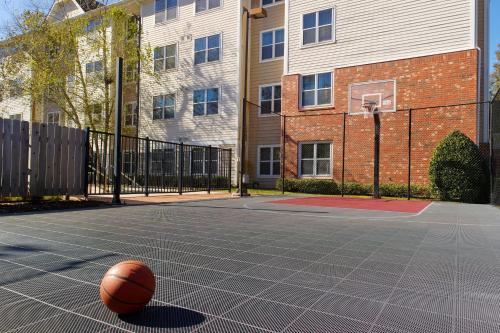 a basketball on a basketball court in front of a building at Residence Inn by Marriott Covington Northshore in Covington