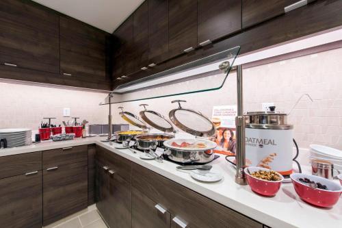 a kitchen with many pots and pans on a counter at Residence Inn by Marriott Nashua in Nashua