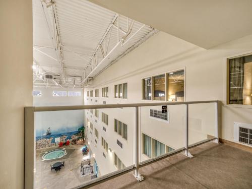 an empty building with a view of a pool at Holiday Inn Lethbridge by IHG in Lethbridge