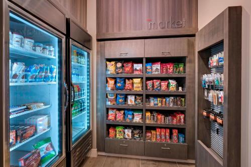 a kitchen with an open refrigerator filled with food at Residence Inn by Marriott St. Paul Downtown in Saint Paul