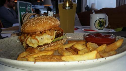 a plate of food with a sandwich and french fries at Apartment U Lipna Nová Pec in Nová Pec