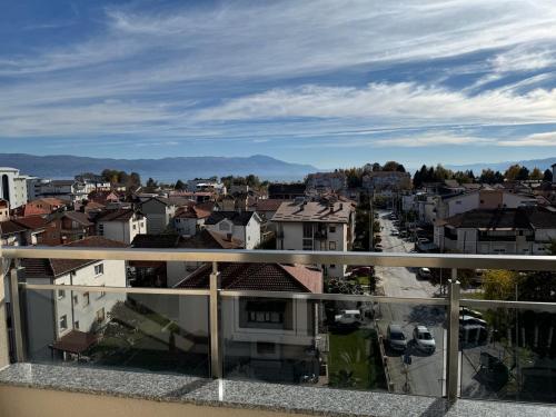 a view of a city from a balcony at Hotel Majestic in Struga