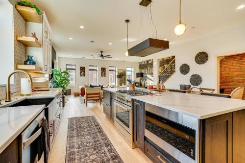 a kitchen with stainless steel appliances and a living room at 1 Block to Lake City Marina Condo with Rooftop Deck in Lake City