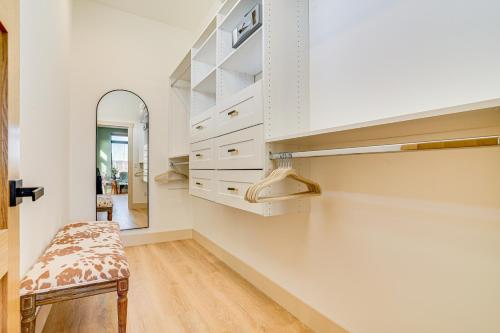 a dressing room with white cabinets and a mirror at 1 Block to Lake City Marina Condo with Rooftop Deck in Lake City