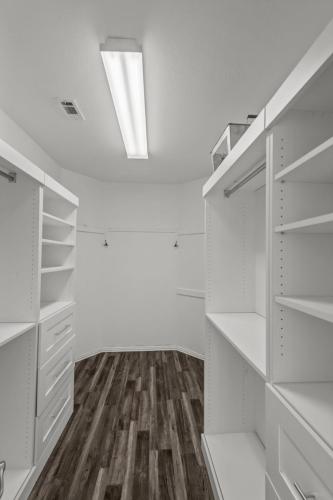 a room with white cabinets and a skylight at Keller's Gem House & Spa in Keller
