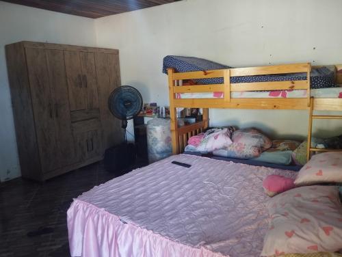 Postel nebo postele na pokoji v ubytování Chácara Lopes