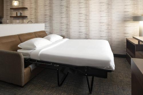 a bed and a couch in a room at Residence Inn Walnut Creek in Walnut Creek