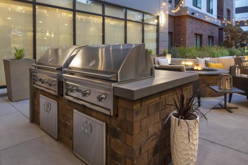 a restaurant with a grill in a patio at Residence Inn Walnut Creek in Walnut Creek