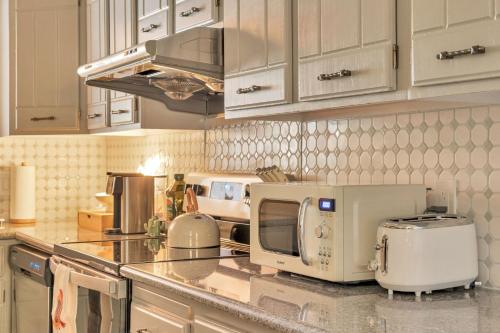 a kitchen with a microwave and appliances on a counter at Our West Nest, Charming 3 BR-5 Bed - Backyard - Olde Town Arvada in Arvada