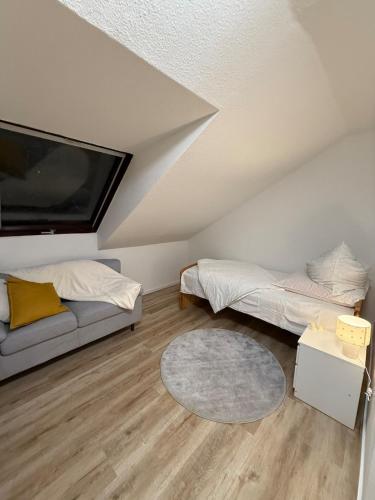a living room with two beds and a tv at Apartment in Gernsbach in Gernsbach