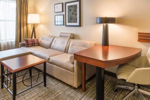 a living room with a couch and a table at Residence Inn Lexington Keeneland/Airport in Lexington