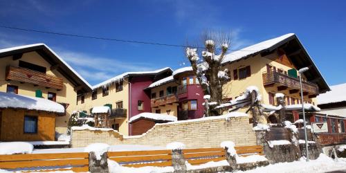 a group of buildings with snow on them at Die Lilie / Hotel Garni in Reutte