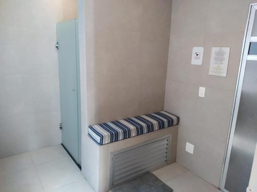 Ένα ή περισσότερα κρεβάτια σε δωμάτιο στο Flat Ginásio Ibirapuera Jardins SP Vaga Inclusa