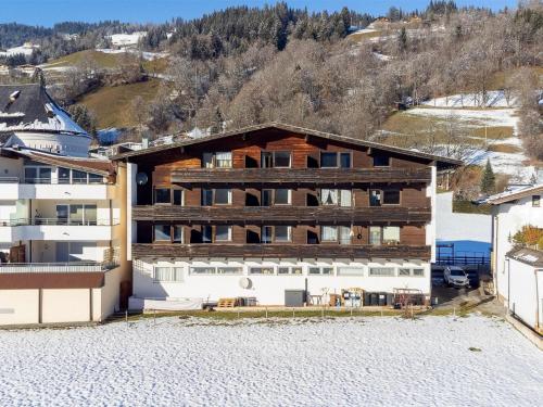 an aerial view of a building with snow on the ground at Brixen Alpin Living Top 1 und 2 und 3 in Brixen im Thale