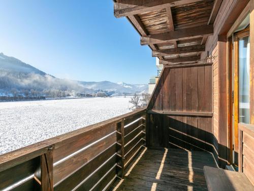 a balcony with a view of a snow covered field at Brixen Alpin Living Top 1 und 2 und 3 in Brixen im Thale