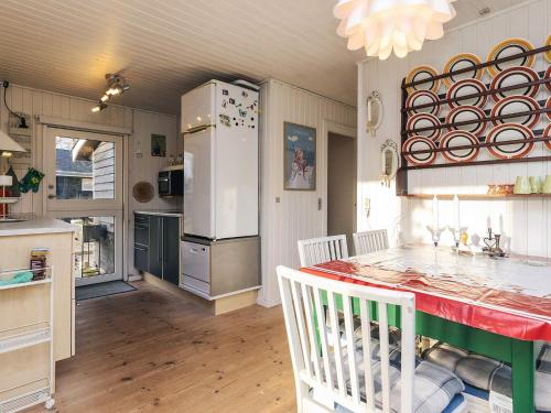 a kitchen with a table and a refrigerator at Charming Family Retreat - By Traum Ferienwohnungen in Hals