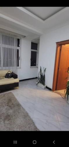 Ένα ή περισσότερα κρεβάτια σε δωμάτιο στο Addis Gerji guest house