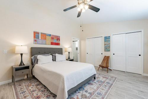 a bedroom with a bed and a ceiling fan at 4-bedroom house in Gilbert - Remodeled Retreat in Gilbert