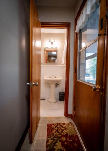 a bathroom with a sink and a toilet at Amazing House Hot Tub Mins To Major Hospitals in Middle Valley