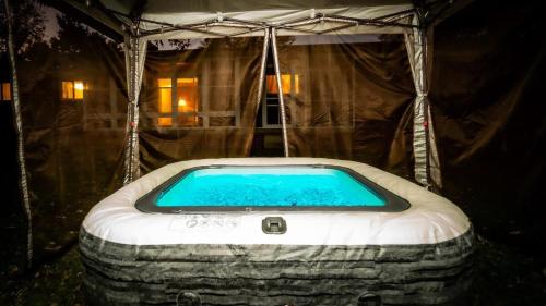 a swimming pool in a yurt with at Amazing House Hot Tub Mins To Major Hospitals in Middle Valley