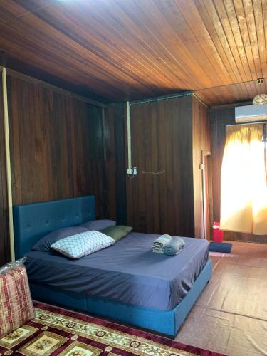 Ένα ή περισσότερα κρεβάτια σε δωμάτιο στο Rosbiwo Homestay