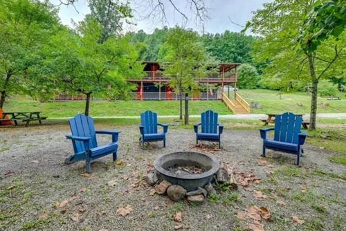 a group of blue chairs around a fire pit at The Hala Lodge and Campground - Roadside Class II -1bed 1bath on Nantahala River in Bryson City