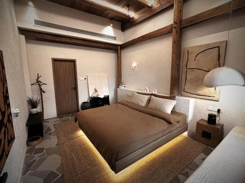 Postel nebo postele na pokoji v ubytování Resort in the valley of Zen 無名川禅意概念酒店