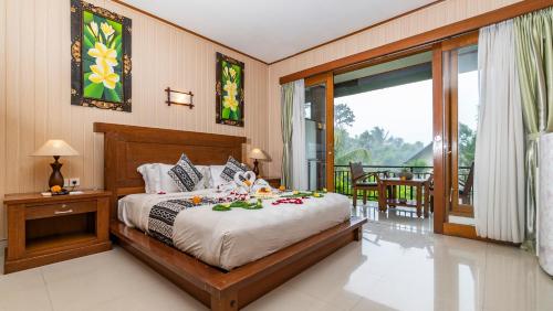 Lova arba lovos apgyvendinimo įstaigoje Gita Maha Ubud Hotel by Mahaputra-CHSE Certified