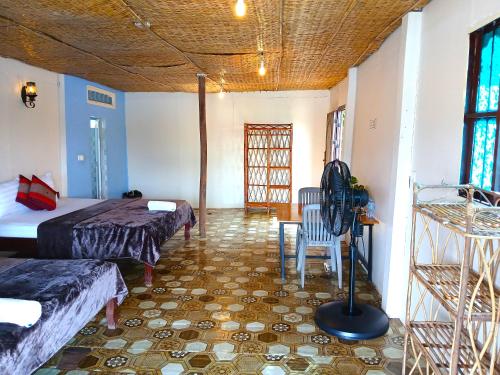 Postel nebo postele na pokoji v ubytování Green Mango Bungalows