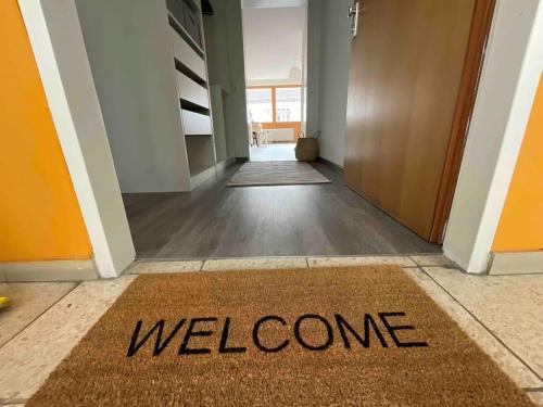 a welcome mat on the floor of a hallway at Loft mit Parkplatz und Balkon in Lörrach