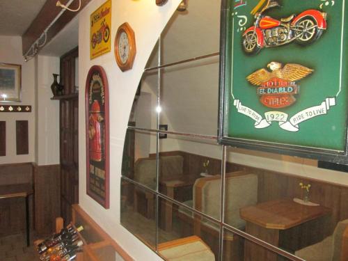 a display window of a motorcycle shop with a sign at Penzion U Holubů Nový Jičín in Nový Jičín
