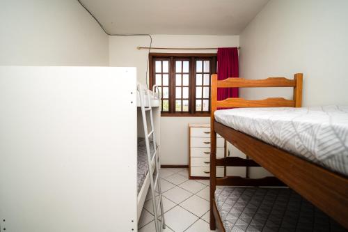 Un ou plusieurs lits dans un hébergement de l'établissement Casa Espaçosa próxima praia do Itapiruba