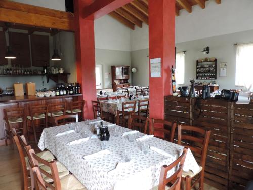 a dining room with tables and chairs in a restaurant at Società Agricola Cacigolara in Borgo Val di Taro