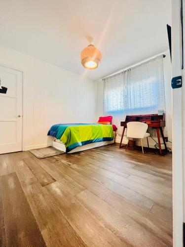 a bedroom with a bed and a desk in it at Party House Heaven in North Hollywood