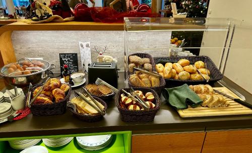 a counter with baskets of pastries and other food at Gästehaus GN8 in Rielasingen-Worblingen