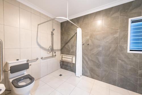 a bathroom with a shower and a toilet at Athena Studio Units in Roma