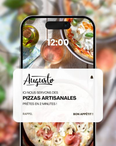 an apple iphone taking a picture of a pizza at Kyriad Direct Le Havre Est - Gonfreville in Gonfreville-lʼOrcher