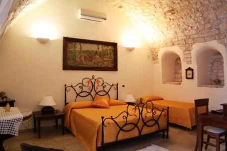 Postel nebo postele na pokoji v ubytování Masseria Casale Dei Fornici