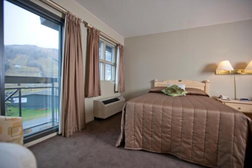 Säng eller sängar i ett rum på Hotel Stoneham