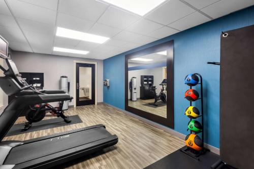 a gym with a treadmill and a mirror at Hampton Inn Marion in Marion