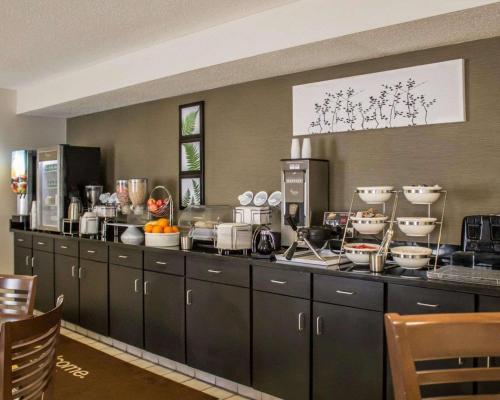a kitchen with a counter with dishes on it at Sleep Inn Sandusky in Sandusky
