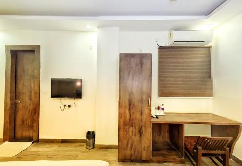 TV a/nebo společenská místnost v ubytování Elegance Suites Hotel, Gomti Nagar